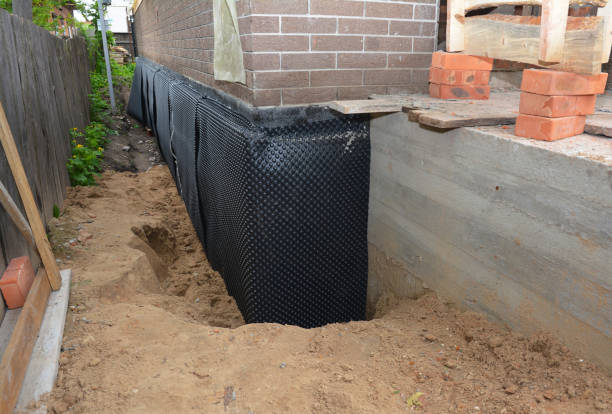 Happy homeowners after waterproofing job in Hamlet